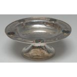 An Arts and Crafts silver coloured metal and enamel circular pedestal tazza,