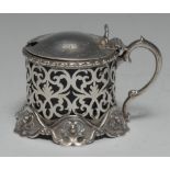 A Victorian Rococo Revival silver mustard, hinged domed cover with shell thumbpiece,