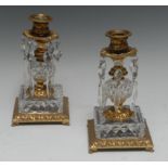 A pair of 19th century Rococo Revival gilt-patinated bronze lustres, beaded lift-out nozzles,