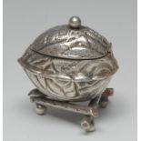 A Victorian silver novelty mustard, as a walnut, hinged cover, triform branch base, ball feet, 5.
