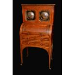 A 19th century satinwood crossbanded rosewood and burr yew cylinder bureau cabinet,
