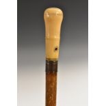 A Queen Anne gentleman's ivory, 'piqué' and malacca walking stick,