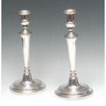 A pair of George III Old Sheffield plate table candlesticks, of seamed construction,
