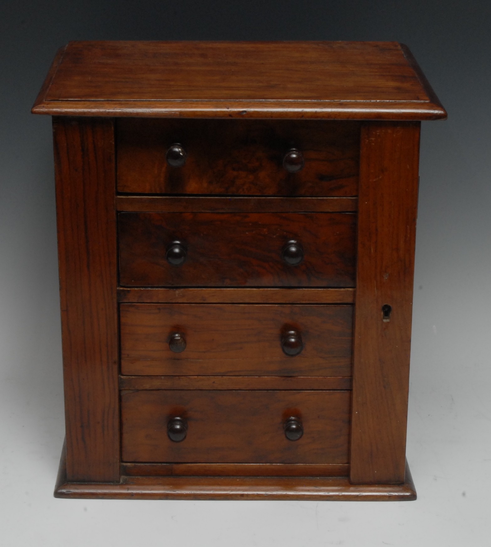 A Victorian walnut table top miniature Wellington chest,