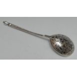 A 19th century Russian silver and niello spoon the bowl decorated to verso with scrolling foliage,