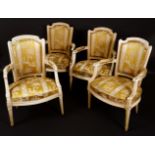 A set of four French fauteuils, of Louis XVI design, tapered backs with arched cresting rails,