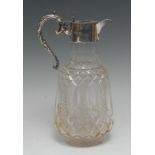 An Edwardian silver mounted hobnail-cut clear glass claret jug, hinged cover with Rococo thumbpiece,