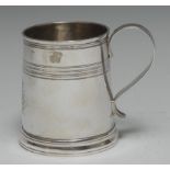 An early George I silver half pint mug, reeded rim above a conforming quarter-girdle, scroll handle,