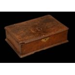 An early 18th century oak lace box, hinged cover initialled ID, brass bat shaped handle, bun feet,