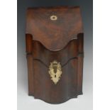 A George III mahogany shaped serpentine knife box, hinged sloping cover enclosing a fitted interior,