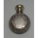 A late Victorian/early Edwardian lady's silver miniature moon-shaped scent bottle, profusely chased,