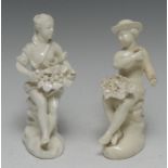 A pair of French soft-paste porcelain Blanc de Chine figures, of a boy and girl,