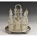 A Victorian silver seven-bottle cruet stand, engraved wit anthemions and scrolls,
