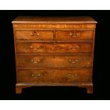 A George III mahogany crossbanded oak chest of drawers,