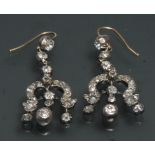 A pair of 19th century diamond encrusted triple arm chandelier droplet earrings,