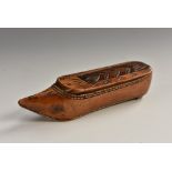 An early 19th century novelty snuff box, as a shoe, chip-carved sliding cover, 8.5cm long, c.
