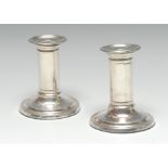 A pair of Victorian silver Doric column candlesticks, cannon barrel pillars, circular bases,
