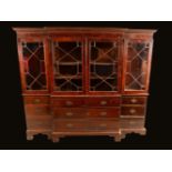 A 19th century mahogany bookcase, dentil cornice above an arrangement of astragal glazed doors,