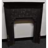 An Aesthetic Movement cast iron fire surround,