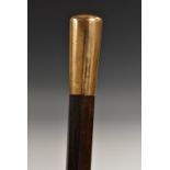 A mid-19th century gentleman's gilt-metal mounted hardwood defence cane, the handle quite plain,