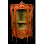 A Louis XV Revival gilt metal mounted mahogany and Vernis Martin shaped serpentine vitrine,