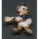 A Walt Disney Inspired Donald Duck diamond, ruby and sapphire encrusted brooch,
