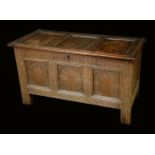 A 17th century oak three panel blanket chest, hinged top, carved front, 67cm high, 120cm wide, c.