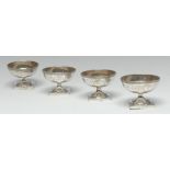 A set of four George III silver circular pedestal salts,