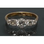 A quintet diamond ring, linear inset with five graduated old brilliant cut diamonds,