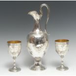 A Victorian silver three piece wine service,