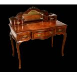 A late Victorian mahogany shaped serpentine writing desk, in the Louis XV Revival taste,