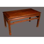 A Chinese hardwood low occasional table, rounded rectangular top above a pierced frieze,