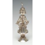An Indian silver figure, of an attendant, she stands,