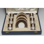 A George V silver mounted Aynsley coffee set, comprising six cans and saucers,