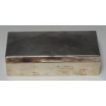 A George VI silver rectangular table cigar or cigarette box, quite plain, hinged cover,