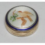 A Continental silver and enamel circular rouge box,