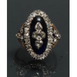 A 19th century Renaissance style diamond and blue cabochon oval panel ring,