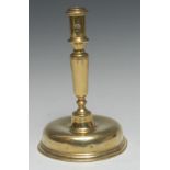 A late 17th century brass candlestick, cylindrical sconce, substantial domed base, 22cm high, c.