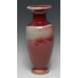 A Chinese monochrome peach bloom ovoid vase, flared rim, 35.