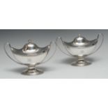 A pair of George III Neo-Classical navette shaped sauce tureens and covers, urnular finials,