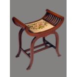 An Edwardian mahogany X-frame dressing stool, petit-point upholstered seat,