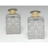 Asprey - a pair of Victorian silver-gilt mounted square hobnail-cut glass cologne bottles,