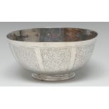 A Chinese silver bowl, engraved with panels of blossoming branches, birds and pagodas, 15.