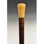 An early 18th century gentleman's yellow metal-mounted, ivory and hardwood walking stick,