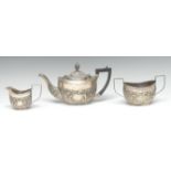A Victorian silver boat shaped bachelors three piece tea service,
