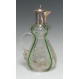 An Art Nouveau period silver mounted claret jug, hinged cover with laurel border,