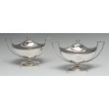 A pair of George III Neo-Classical silver urnular pedestal sauce tureens, domed covers,