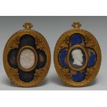 A pair of Neo-Gothic design ormolu oval frames,