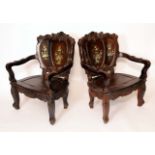 A pair of substantial Chinese hardwood armchairs,