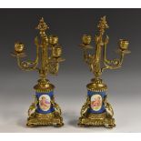 A pair of 19th century French gilt-metal mounted Sèvres-type three-branch candelabrum,